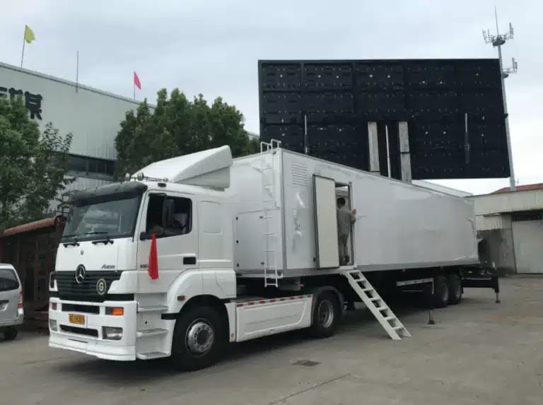 Mobile LED trailer truck with large outdoor LED screen display setup.
