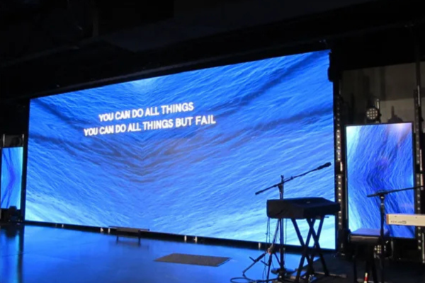 Large Jumbotron screen for home stage setup displaying text visuals