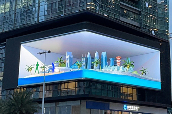 Jumbotron 3D LED display on a building creating an illusion of a curved cityscape