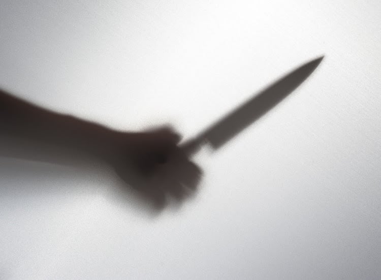 37915812 - silhouette of someone holding knife,blur image