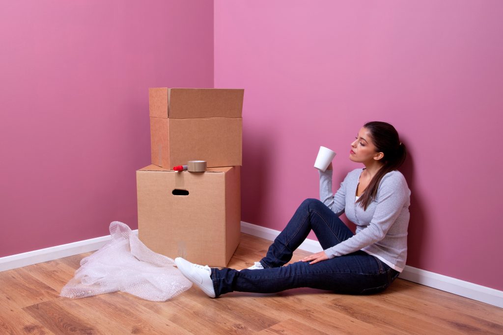 4567810_xxl-An-attractive-young-woman-takes-a-break-during-her-house-move-1024x683