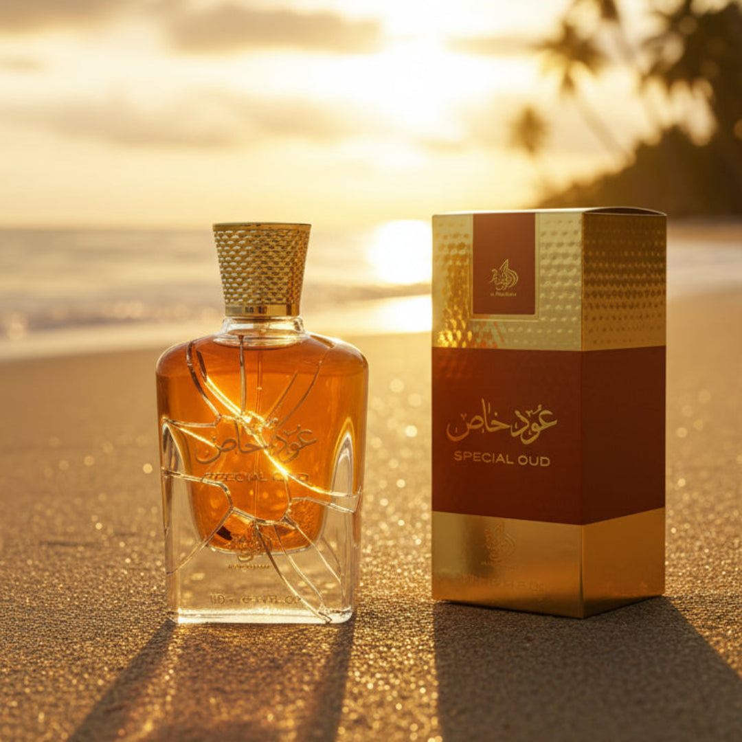 Perfume bottle broken, amber glow emerging; Langkawi beach at sunset Malaysia &mdash; clear bottle and box, cinematic lighting.