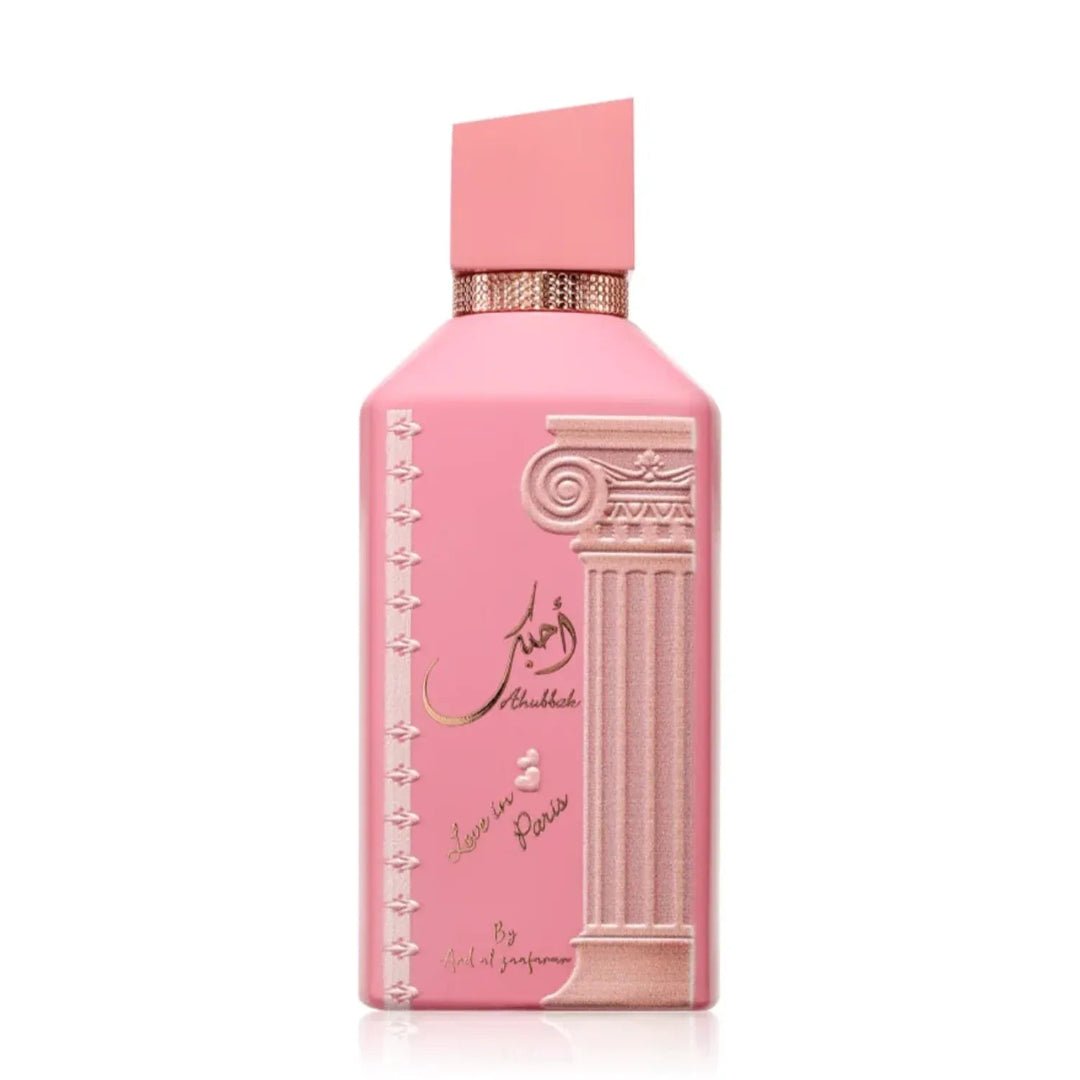 Pink perfume bottle with decorative elements on a white background