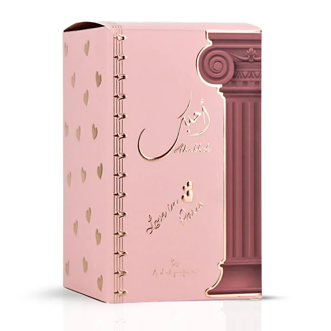 Pink notebook with decorative design and text on a white background