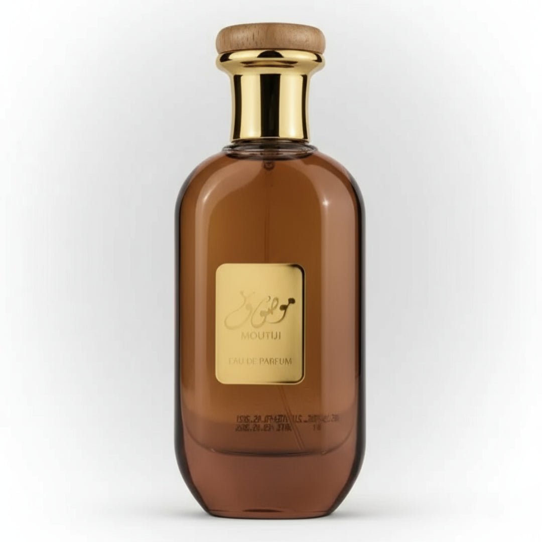 Brown perfume bottle with gold cap on a white background