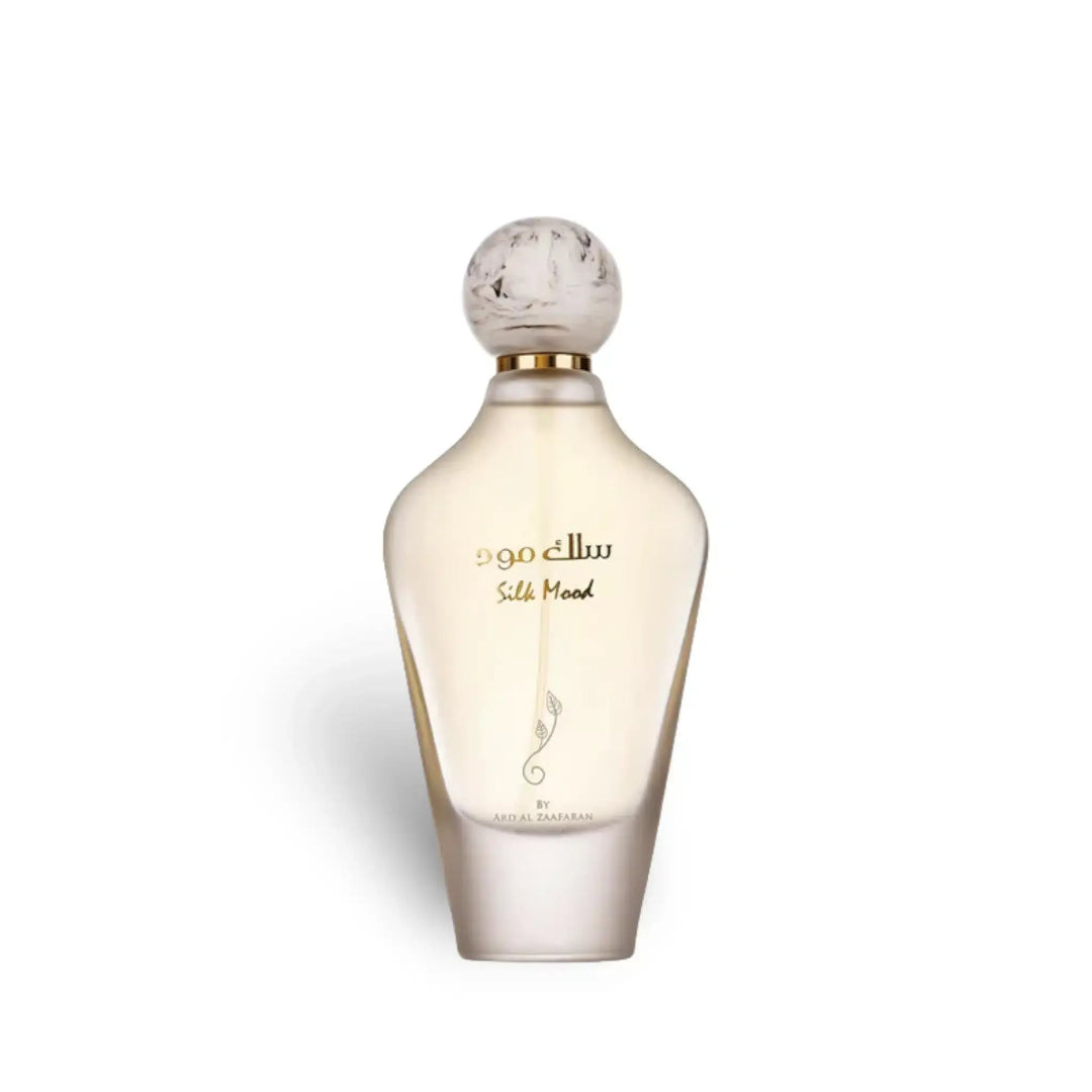 Perfume bottle with marble cap on a white background
