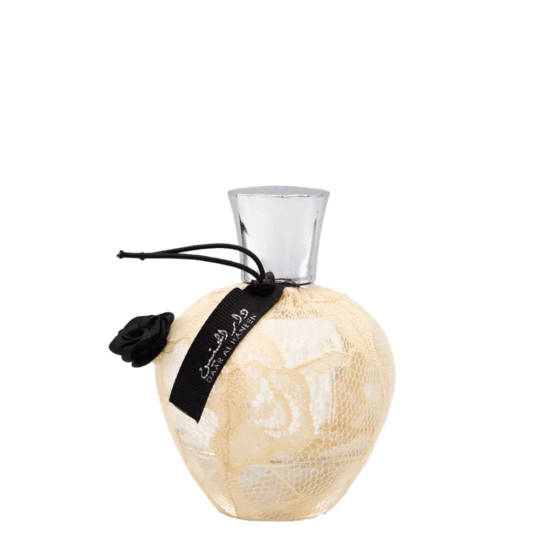 Decorative bottle with textured surface and black ribbon on a white background