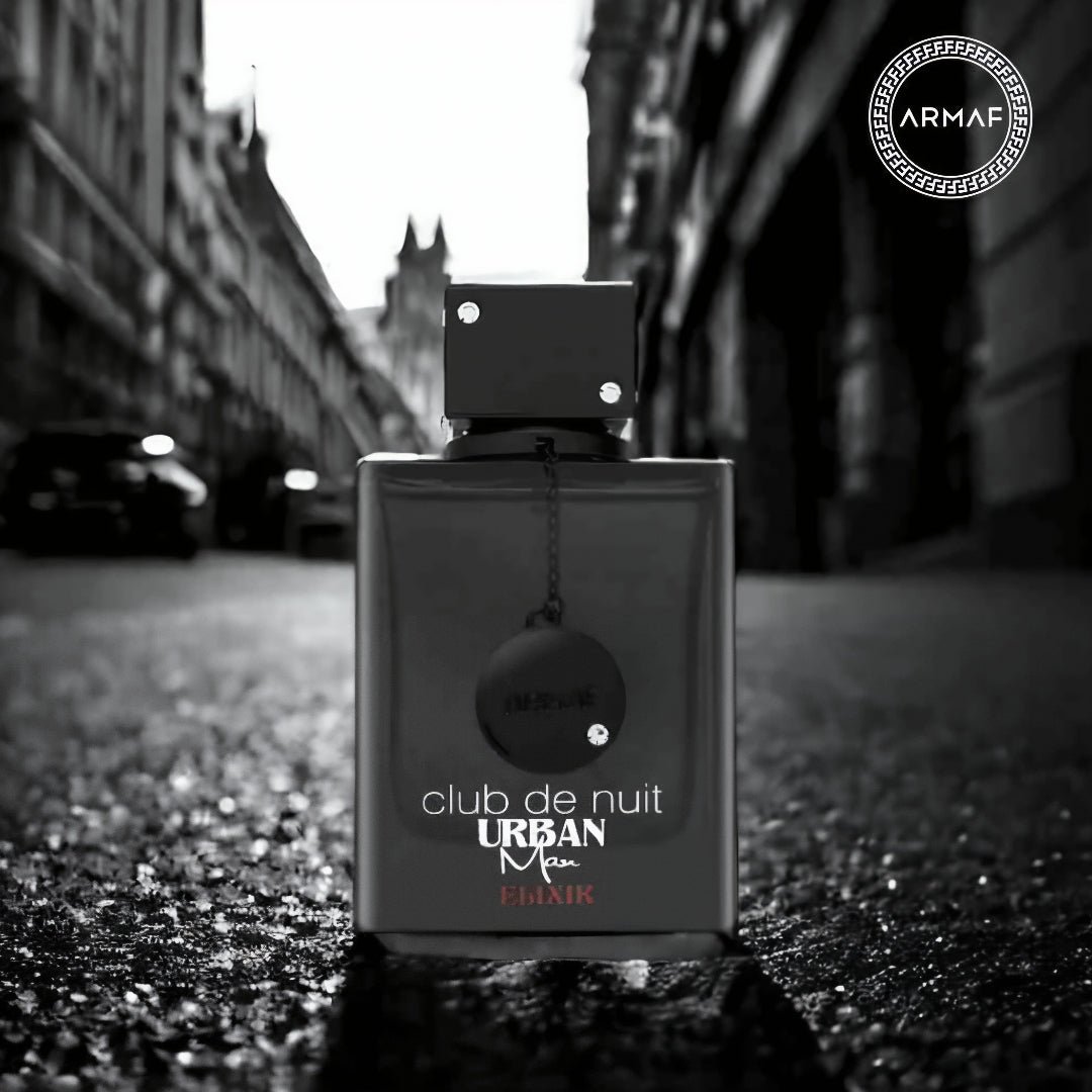 Perfume bottle labeled 'club de nuit Urban Man' by Armaf on a city street.