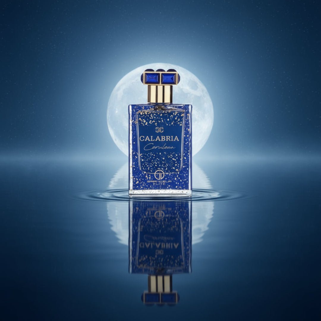 Blue speckled perfume bottle with gold accents and a keychain on a white background