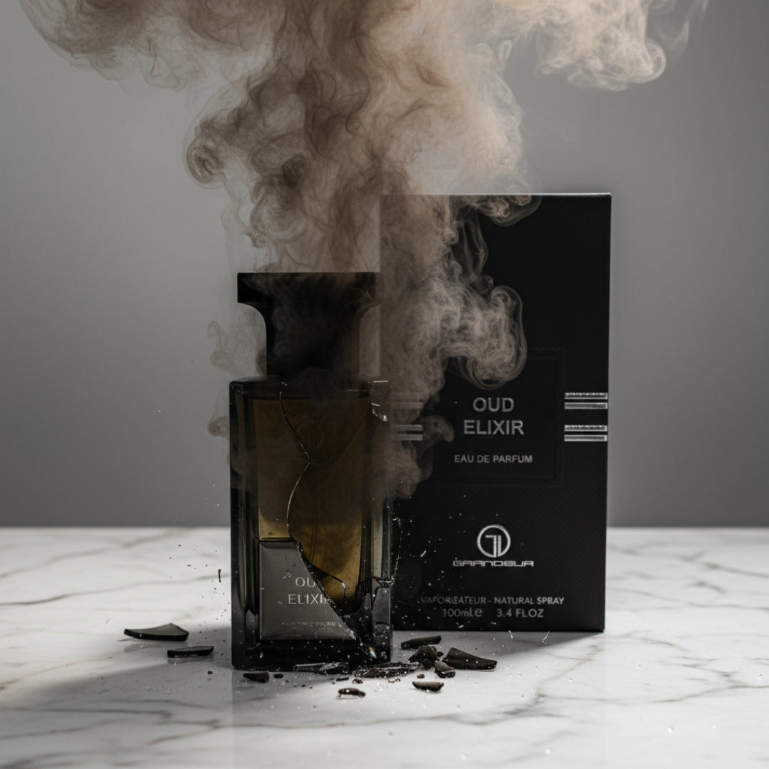 Oud Elixir Perfume Perfume bottle broken, fog emerging; studio on white marble Malaysia &mdash; clear bottle and box, cinematic lighting