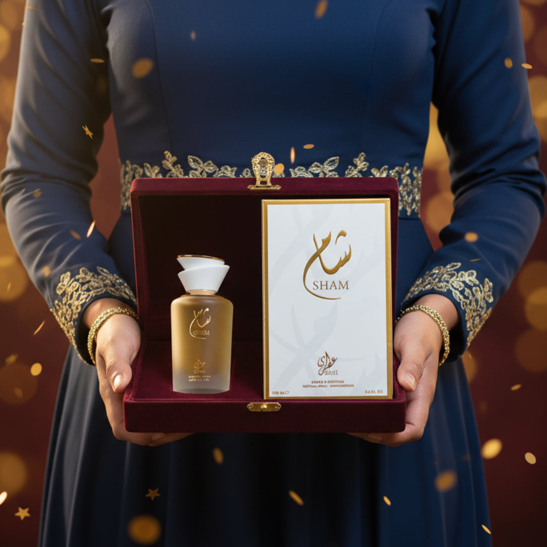 Malaysian woman reveals Sham Perfume Woman &mdash; Gulf Orchid bottle and box from a velvet gift; warm spotlight, clear product.