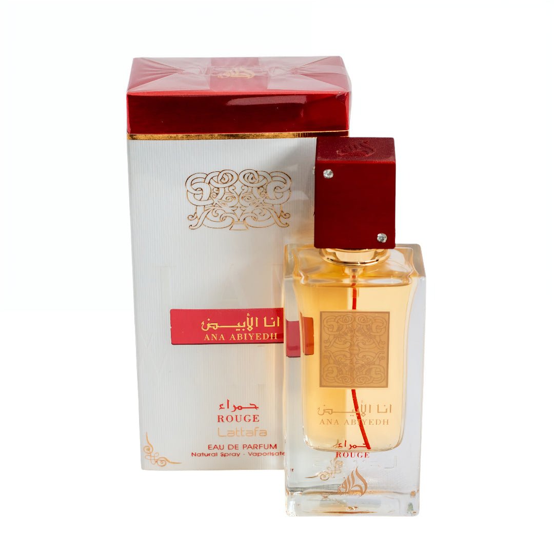Perfume bottle and packaging with gold and red design on a white background Ana Abiyedh Rouge Lattafa Perfumes for women and men