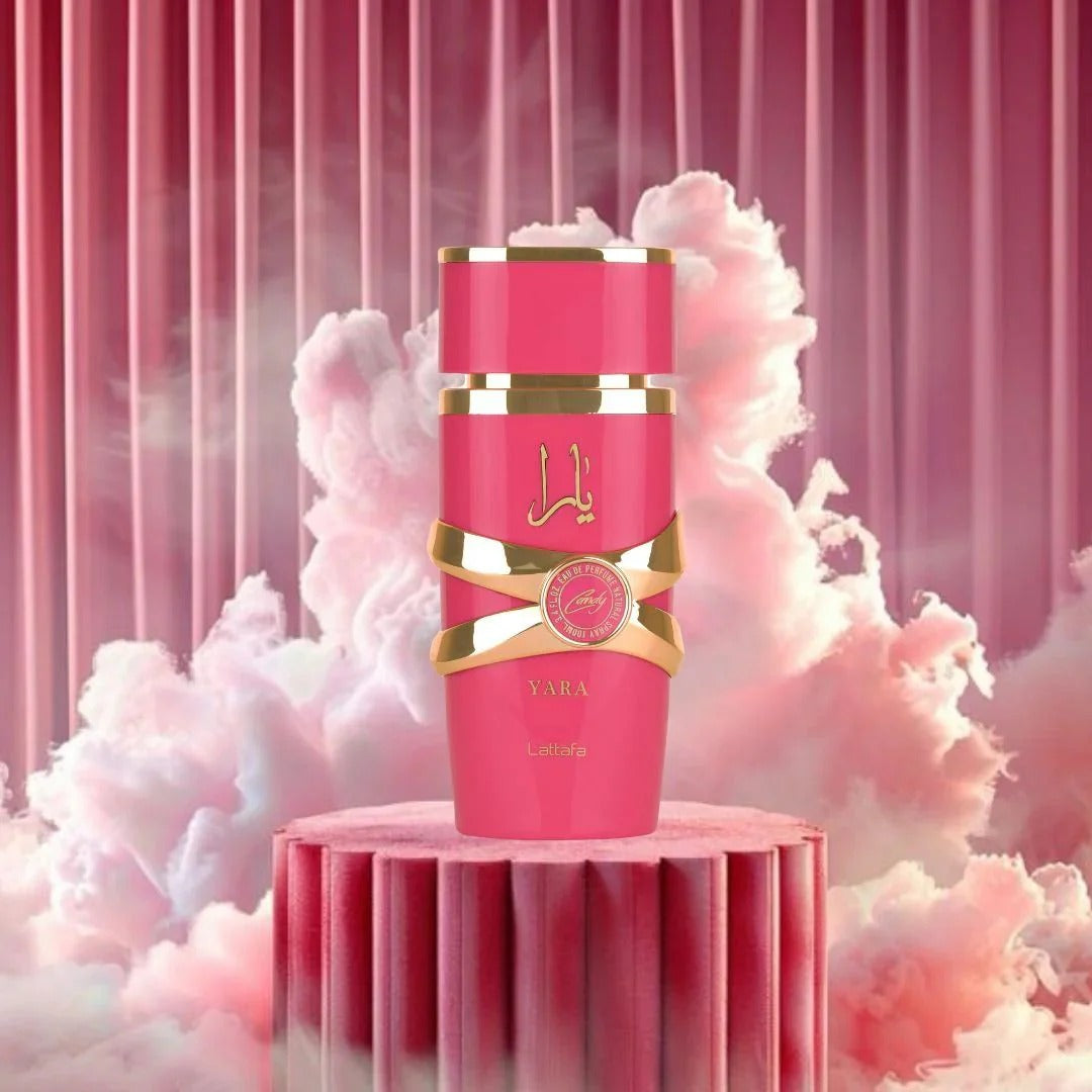 Kotak Yara Candy Pink and gold cosmetic product on a pink platform with a pink cloud background