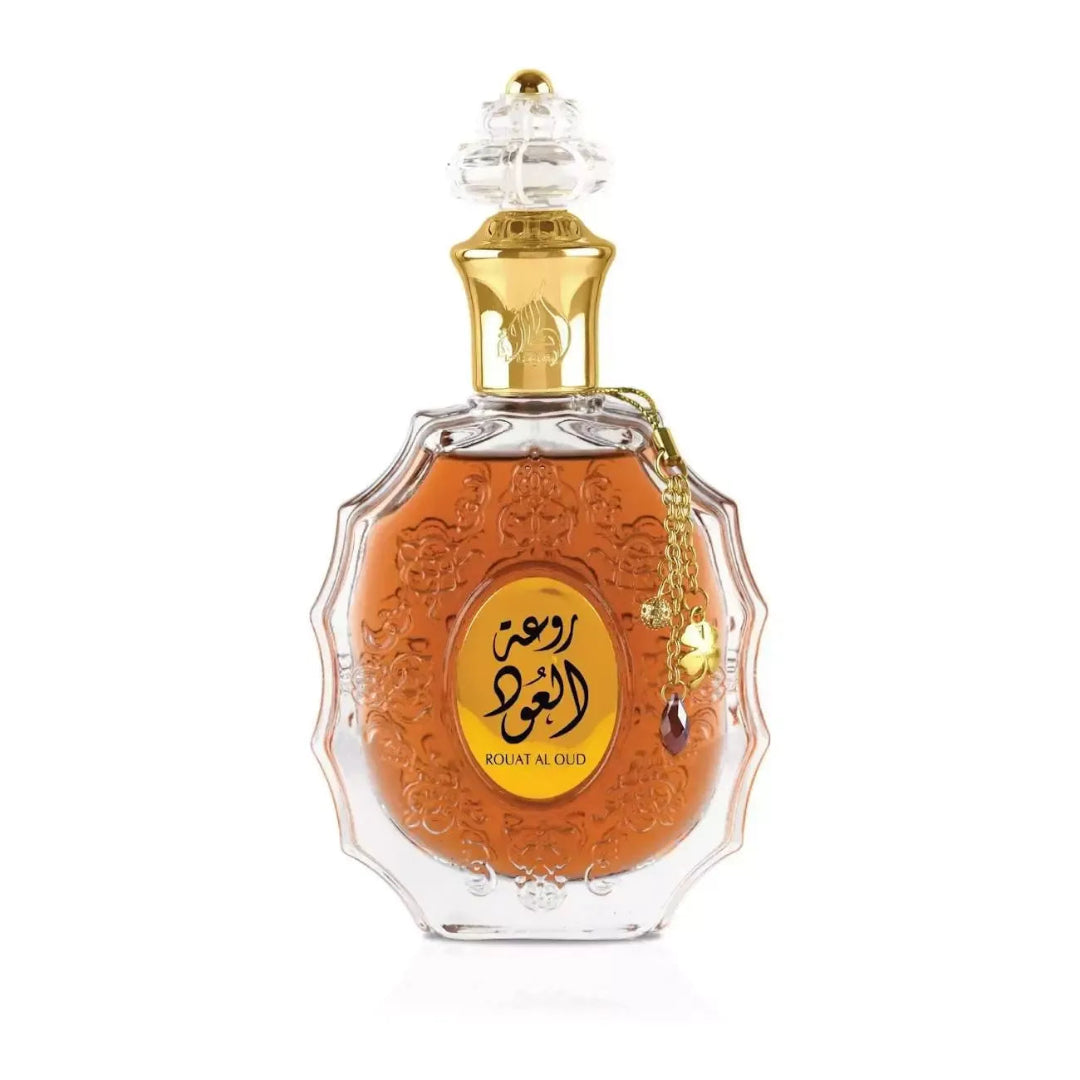 Perfume bottle with intricate design and gold accents on a white background