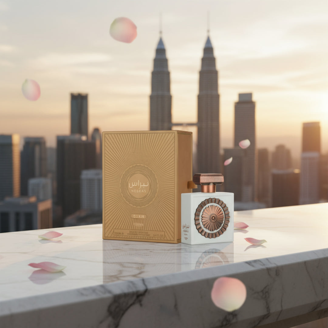 Nebras Elixir on marble balcony with drifting rose petals and KL skyline bokeh; bottle and box clearly visible.
