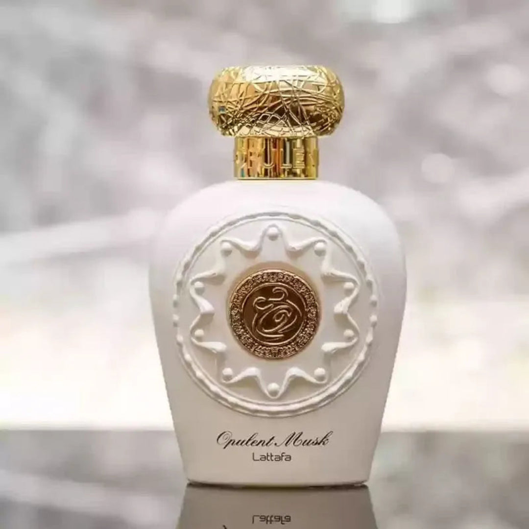 Opulent Perfume bottle with gold cap and intricate design on a blurred background