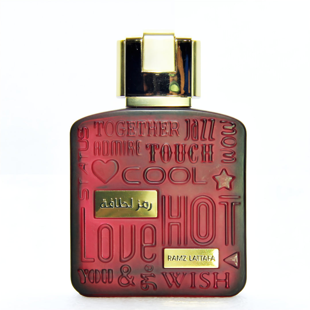 Red perfume bottle with gold cap on a white background lattafa ramz gold
