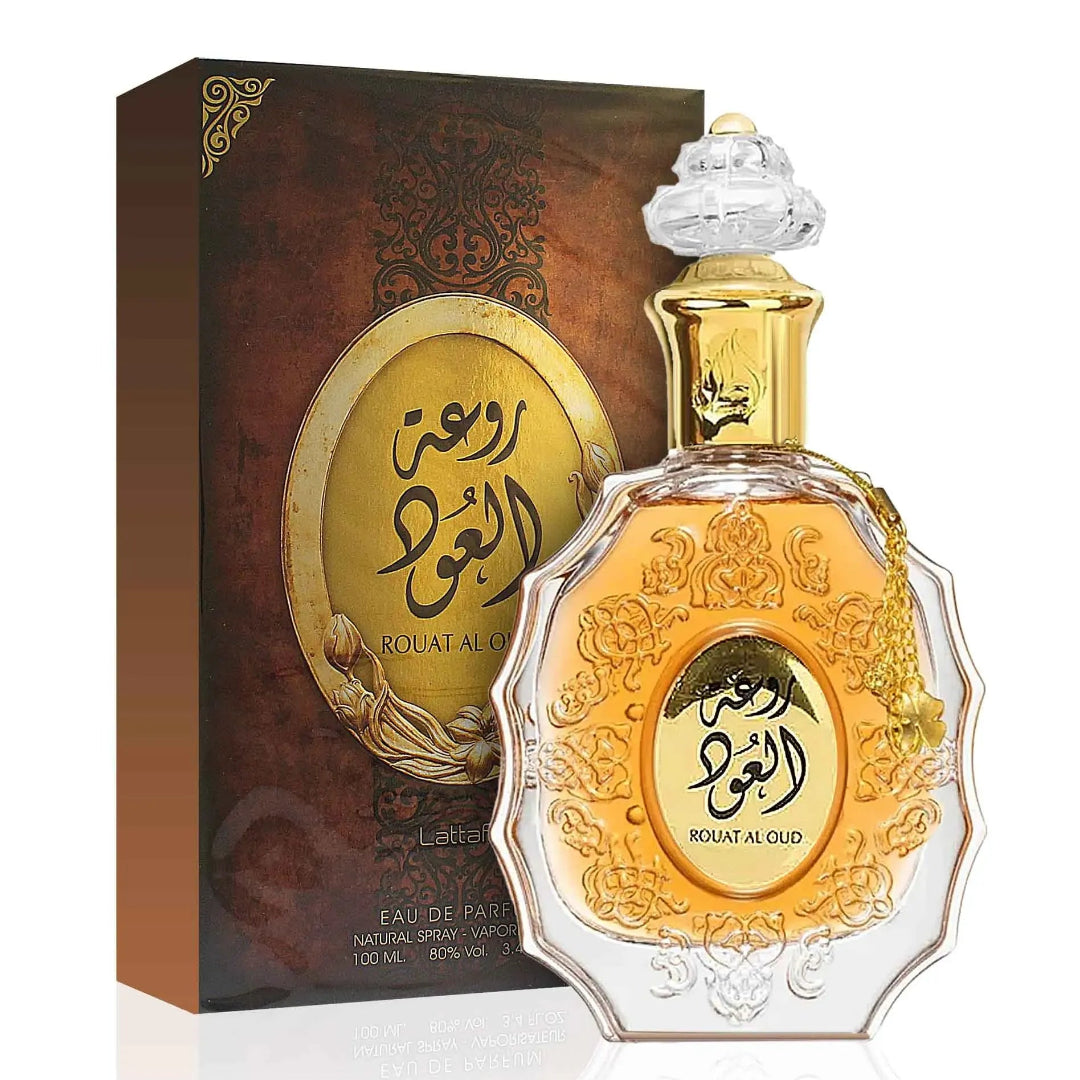 Perfume bottle and packaging with intricate designs on a white background
