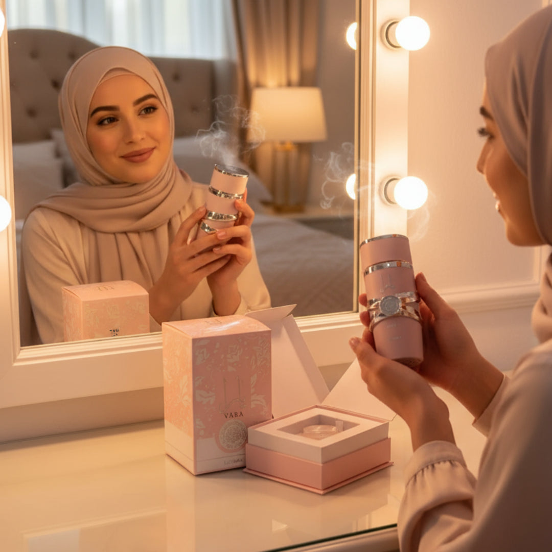 Malay hijabi woman holding perfume in front of mirror with warm light and soft mist &ndash; elegant women fragrance Malaysia