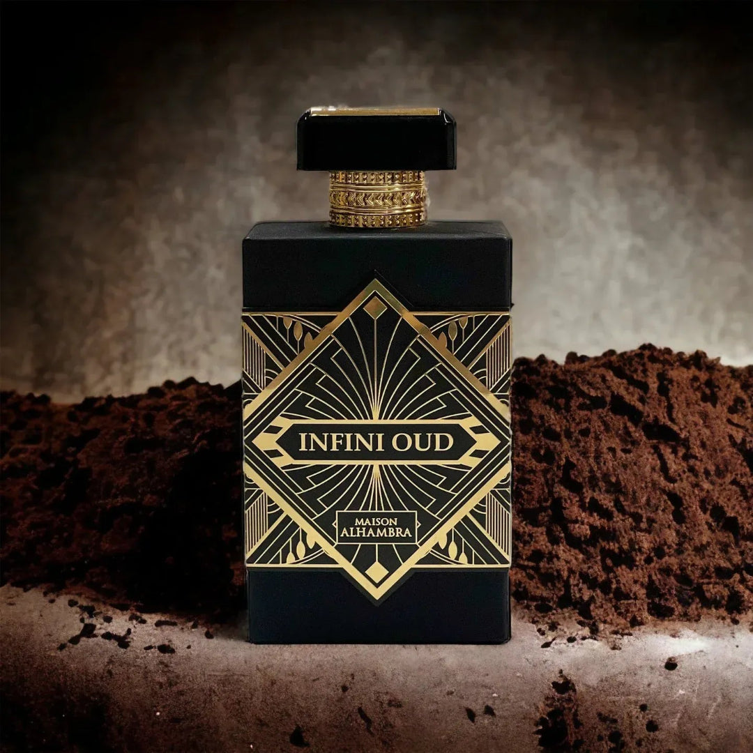 Perfume bottle labeled 'Infini Oud' with gold accents on a textured brown background