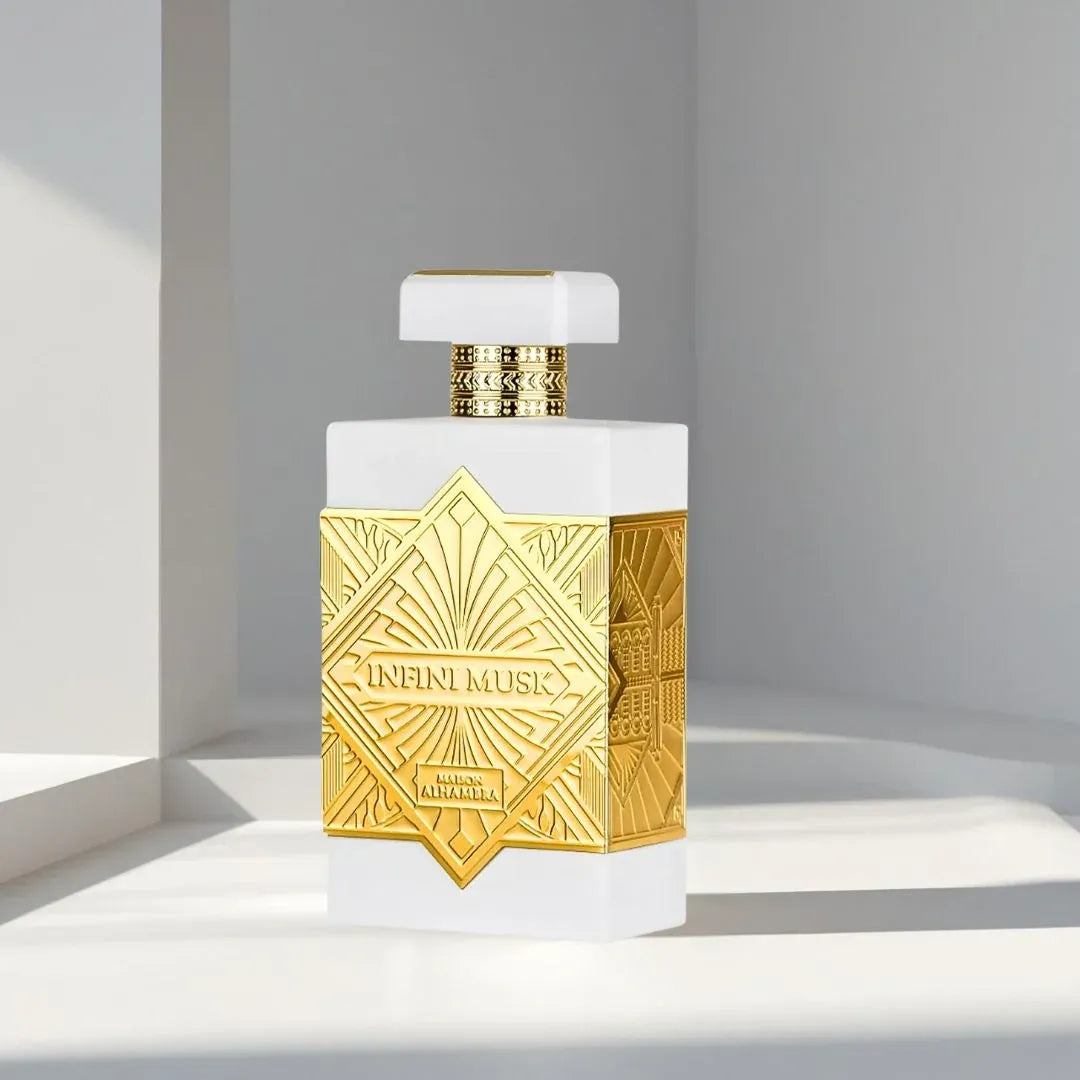 Perfume bottle with gold and white design on a light background
