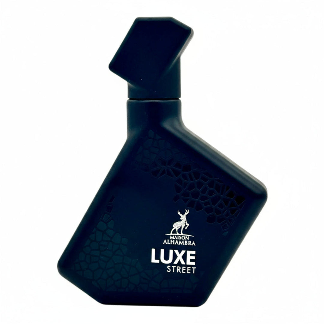 Dark blue bottle of Maison Alhambra Luxe Street perfume on a white background