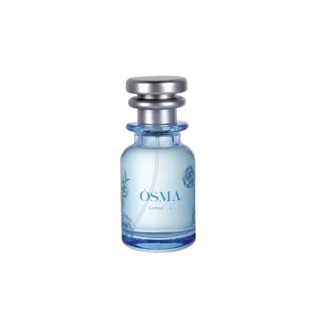 Blue Osma perfume bottle on a light gray background