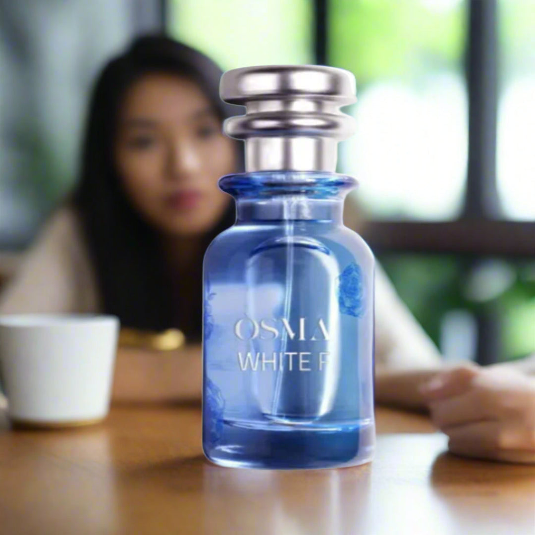 Blue perfume bottle labeled 'Osmia White' with 'Parfumo' logo on a white background