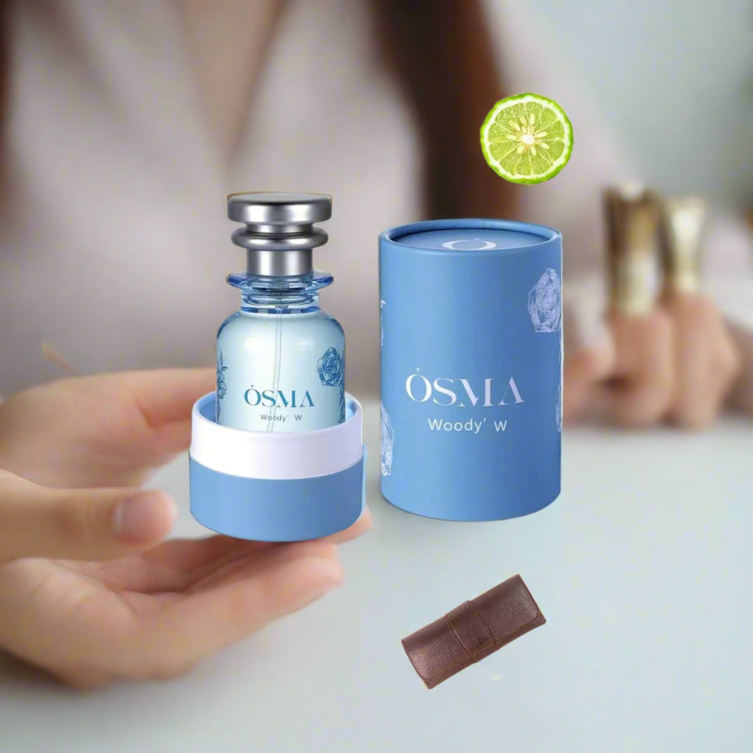 Osmia perfume bottle and packaging with ingredients displayed on a light blue background