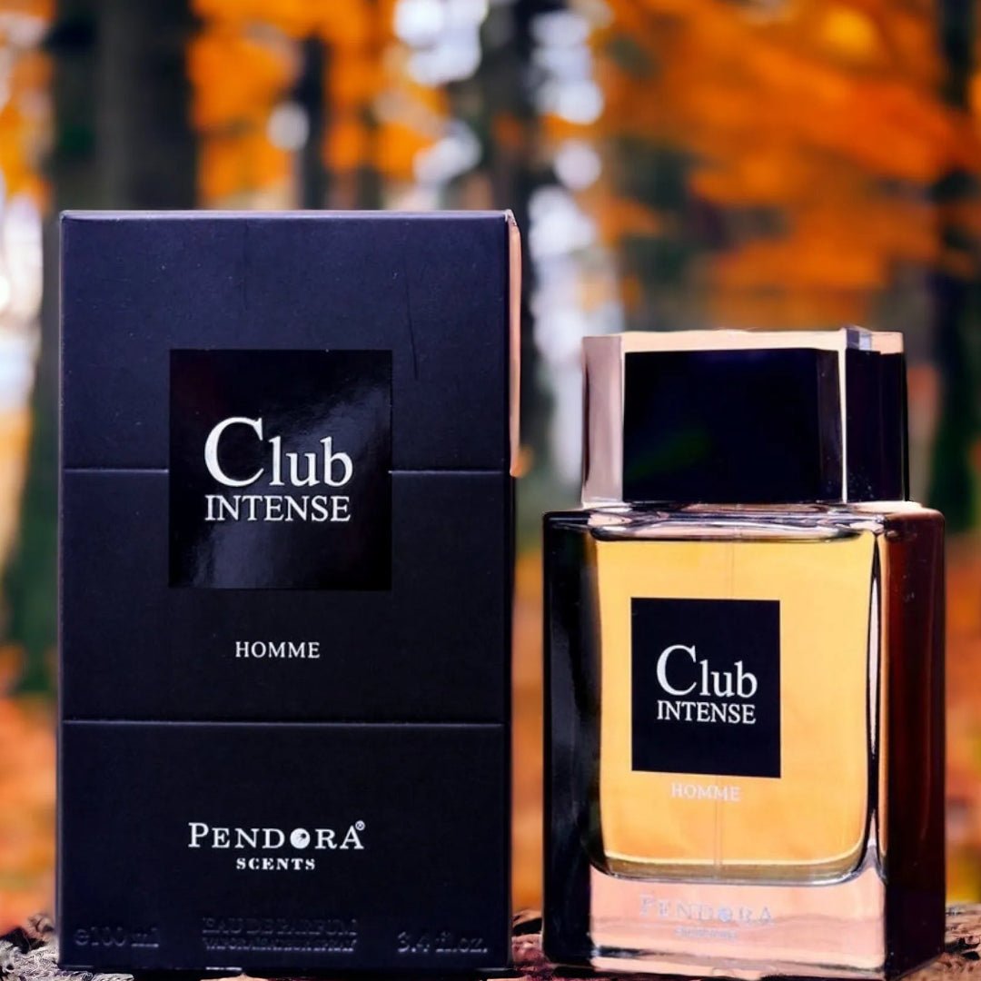 Pendora Scents Club Intense perfume bottle and packaging on a wooden surface with an autumn background.