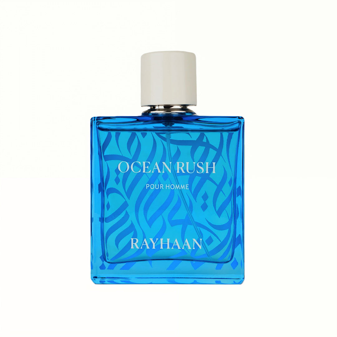 Blue perfume bottle labeled 'Ocean Rush Pour Homme' by Rayhaan on a white background