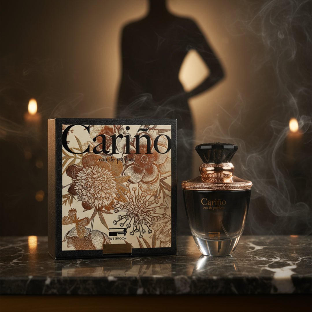 Carino Black by Rue Broca perfume bottle and box on dark marble candlelight women scent Malaysia
