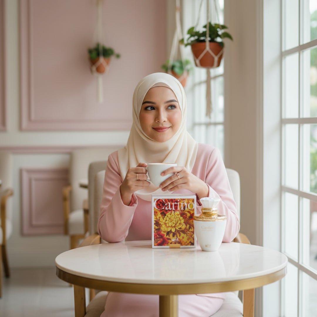 Malay woman café with Carino White by Rue Broca perfume bottle women’s fragrance Malaysia”