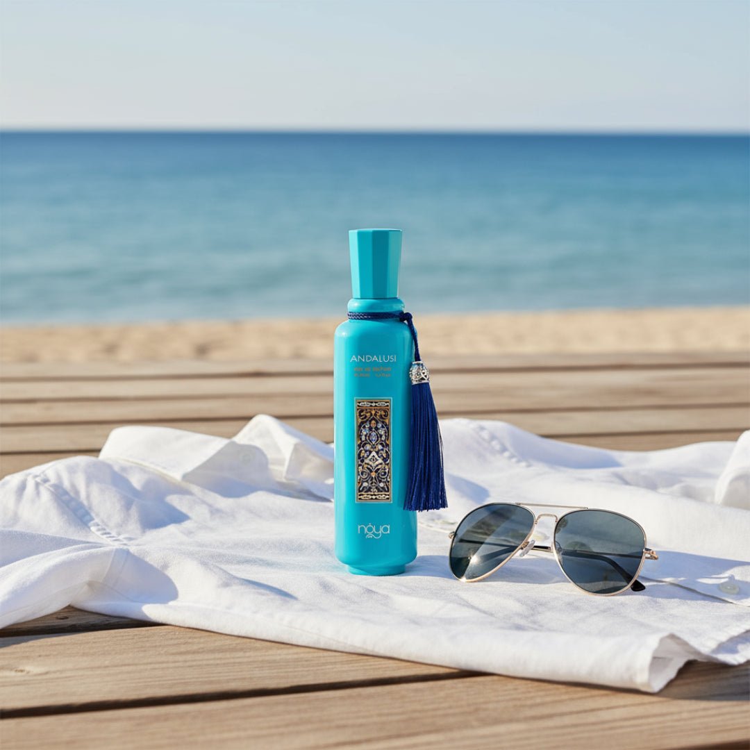 Andalusi Blue by Zimaya perfume bottle on linen shirt with sunglasses beach deck Malaysia