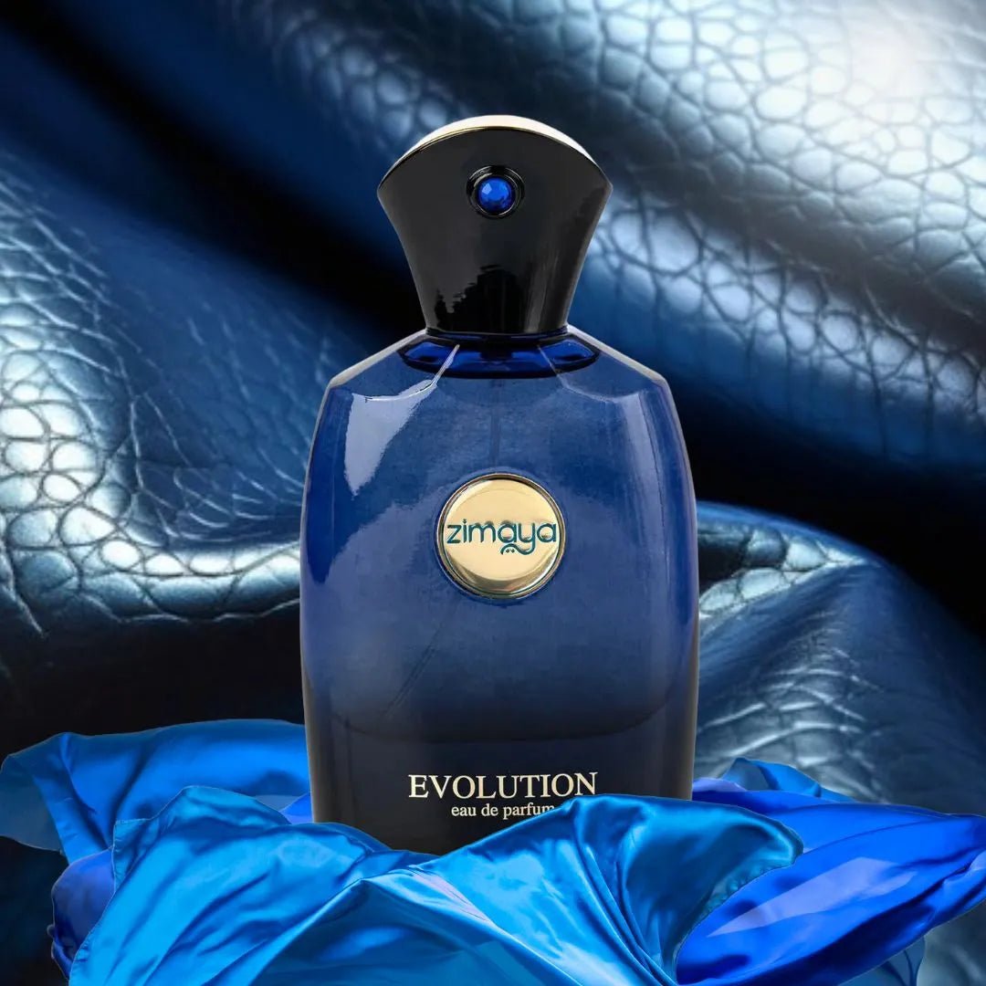 Blue perfume bottle labeled 'zimaya' with 'EVOLUTION' on a textured blue background