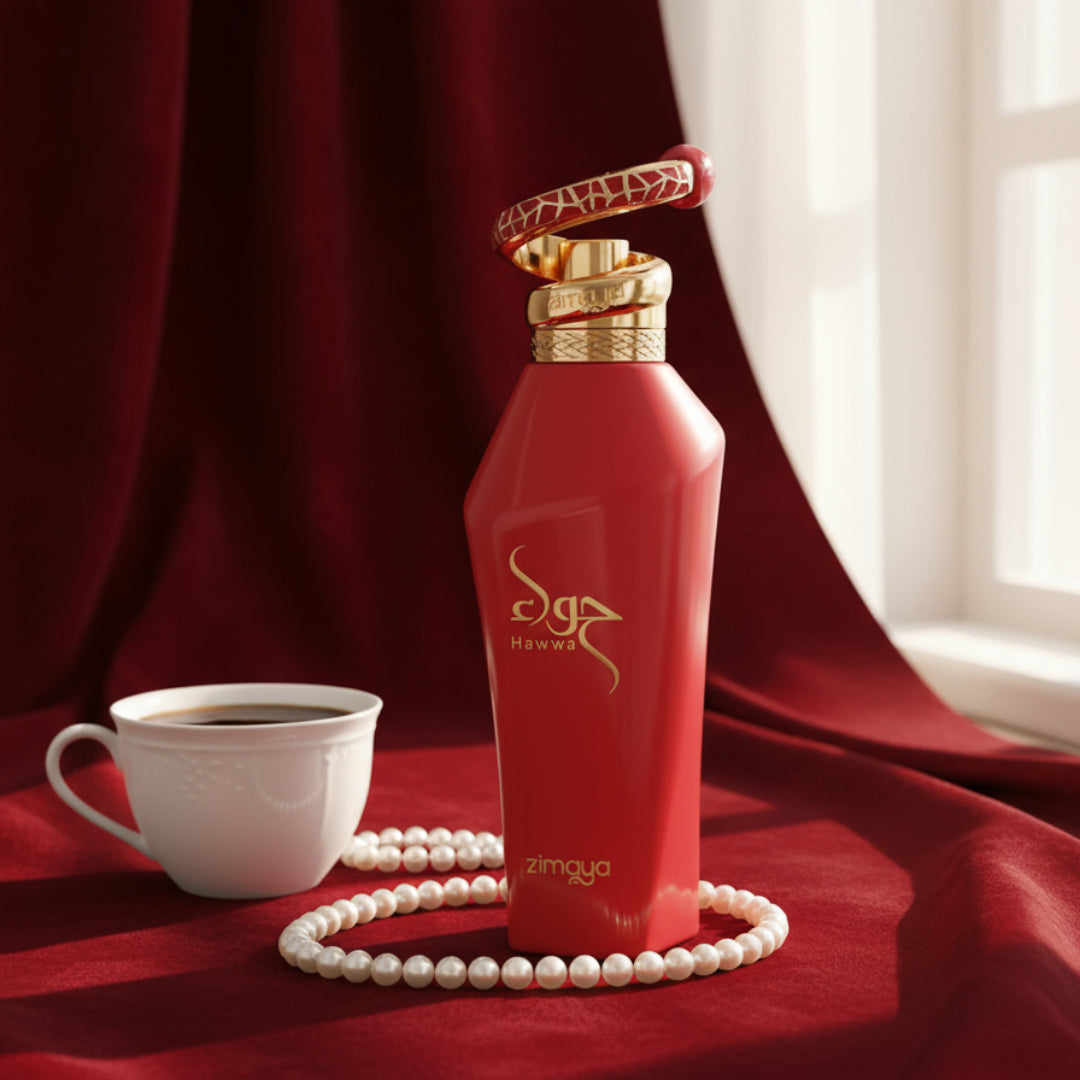 Hawwa Red by Zimaya perfume bottle on velvet cloth with coffee cup and pearls morning light Malaysia