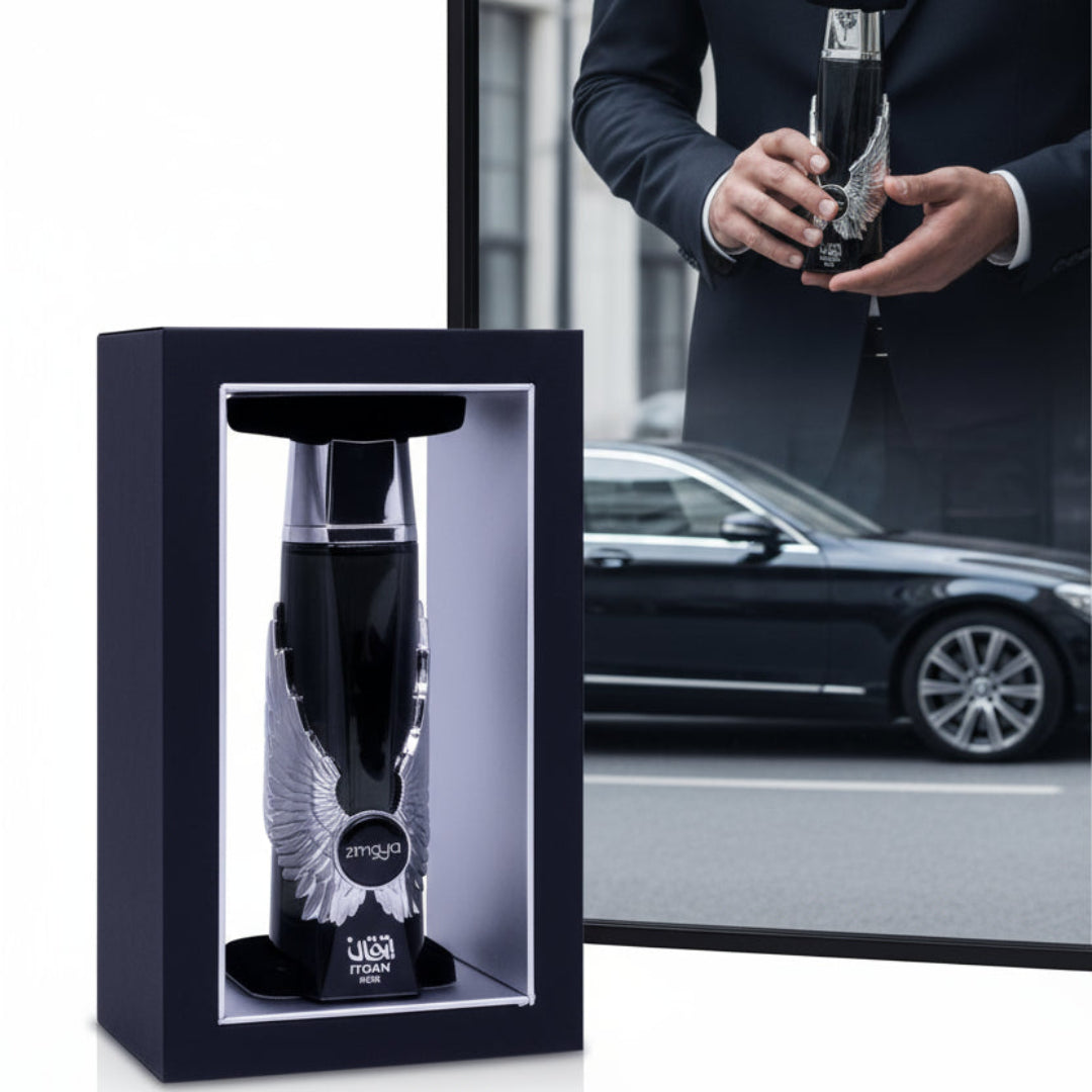 Itqan Noir by Zimaya perfume bottle in man’s hand wearing suit with luxury car reflection Malaysia