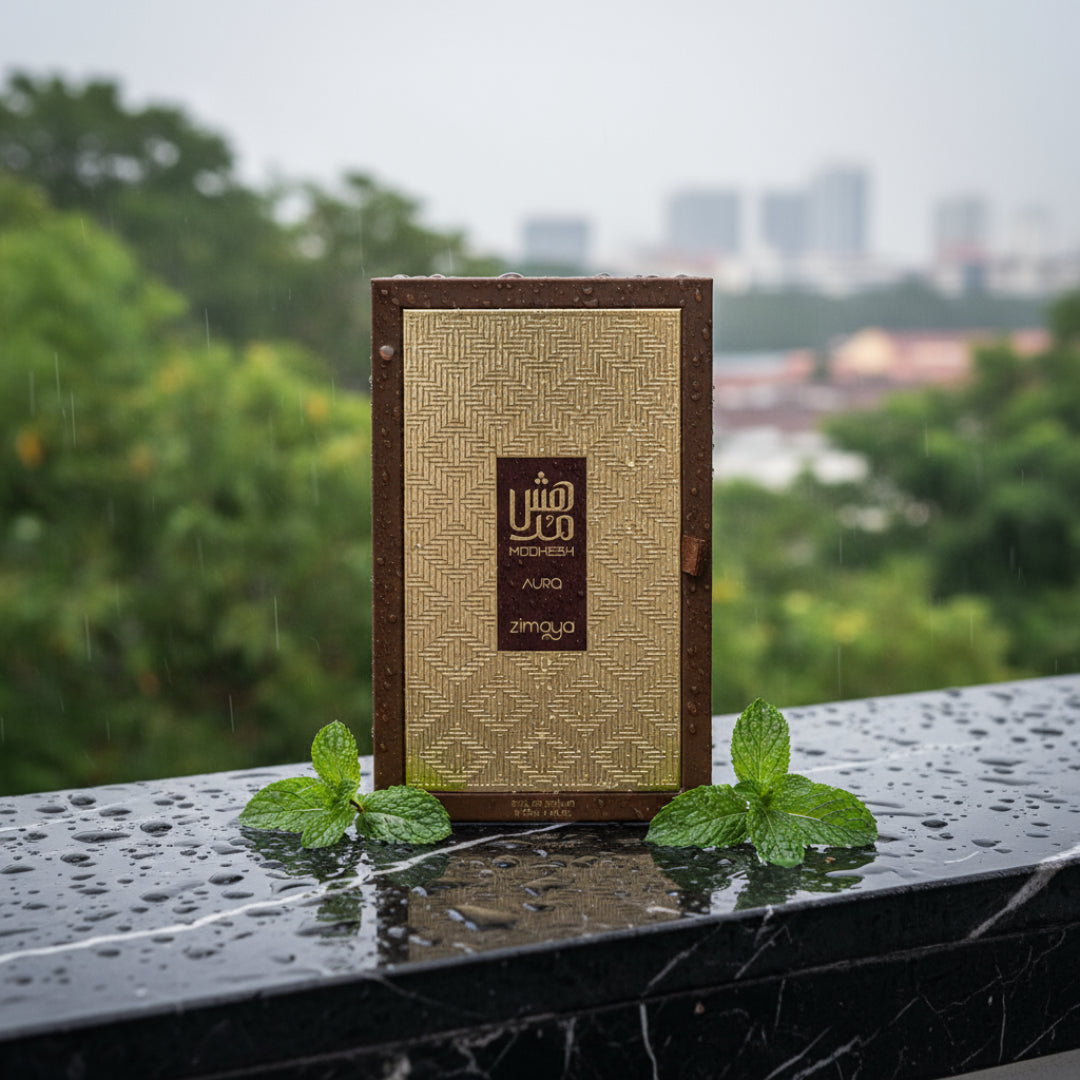 Men’s oriental woody perfume bottle on rain-wet black marble with mint leaves Malaysia &ndash; Modhesh Aura