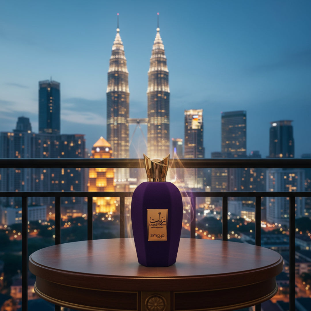 Rabab Gems by Zimaya perfume bottle on balcony table with KL lights blue hour luxury scent Malaysia