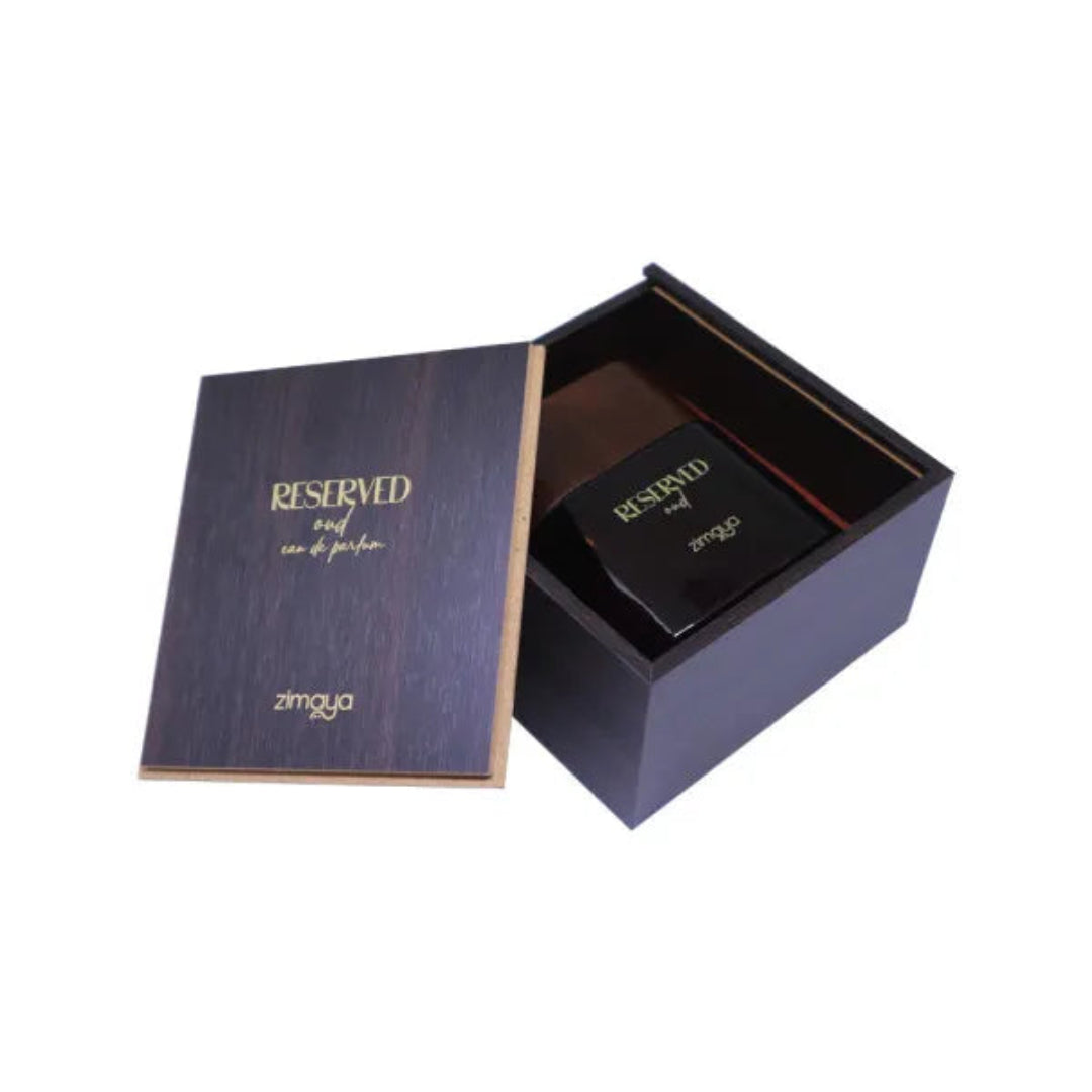 Open box containing a black perfume bottle labeled 'zimoya' on a white background