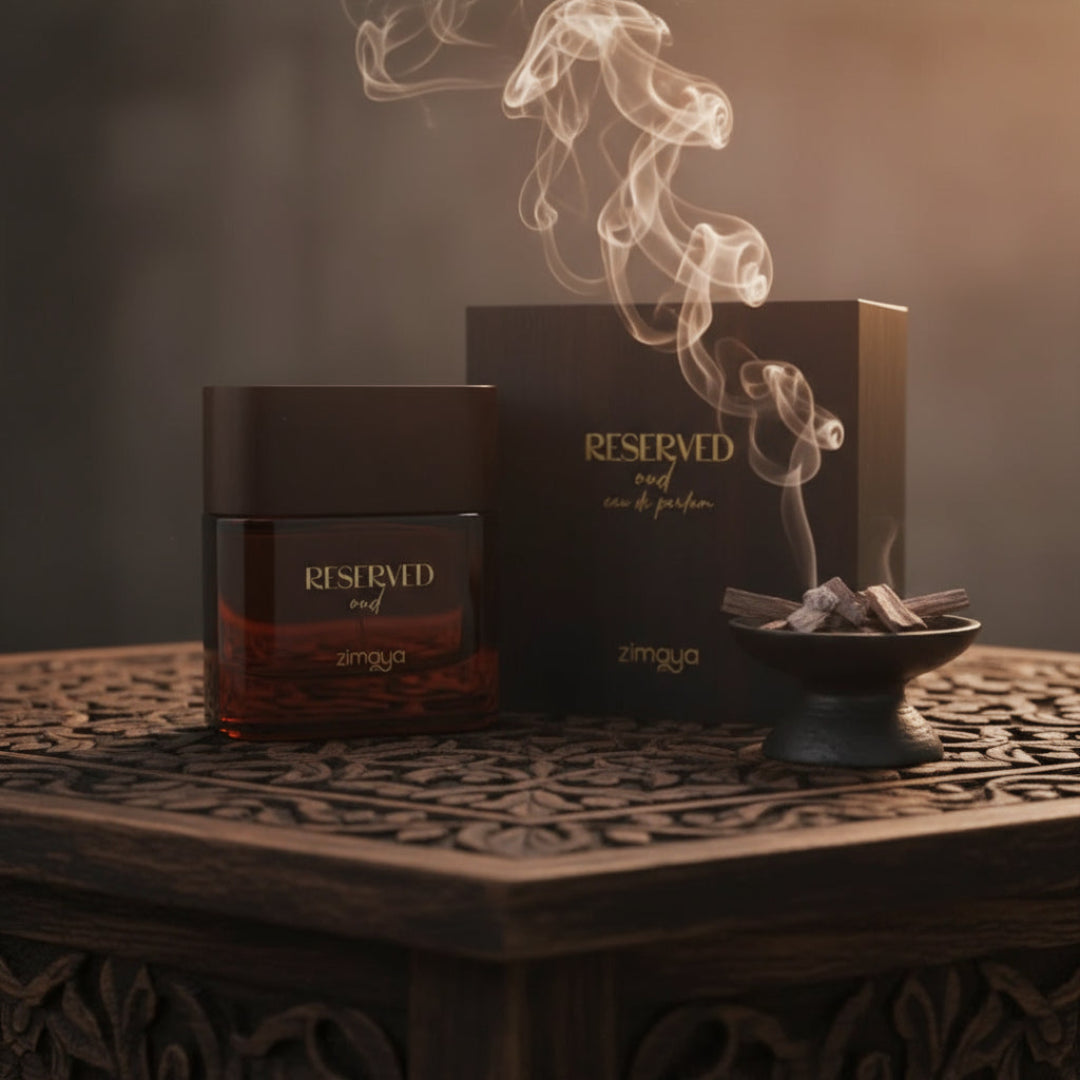 Reserved Oud by Zimaya perfume bottle with oud chips smoke and amber light unisex fragrance Malaysia