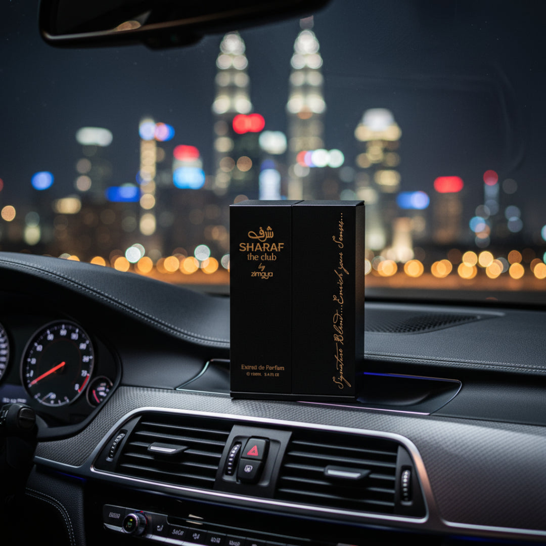 Sharaf The Club by Zimaya perfume bottle on car dashboard with city lights prestige men perfume Malaysia