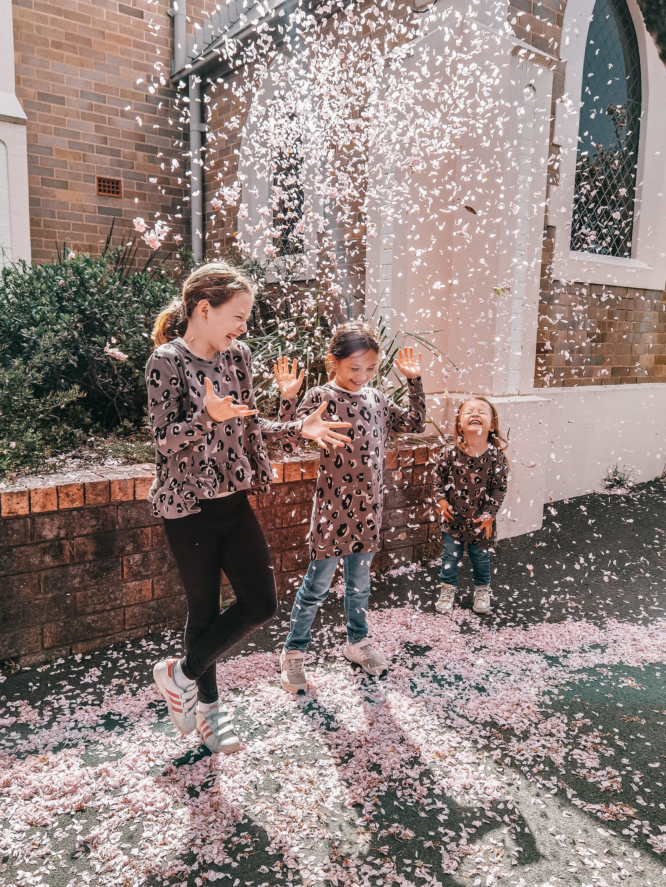 3 joyful kids playing in the snow