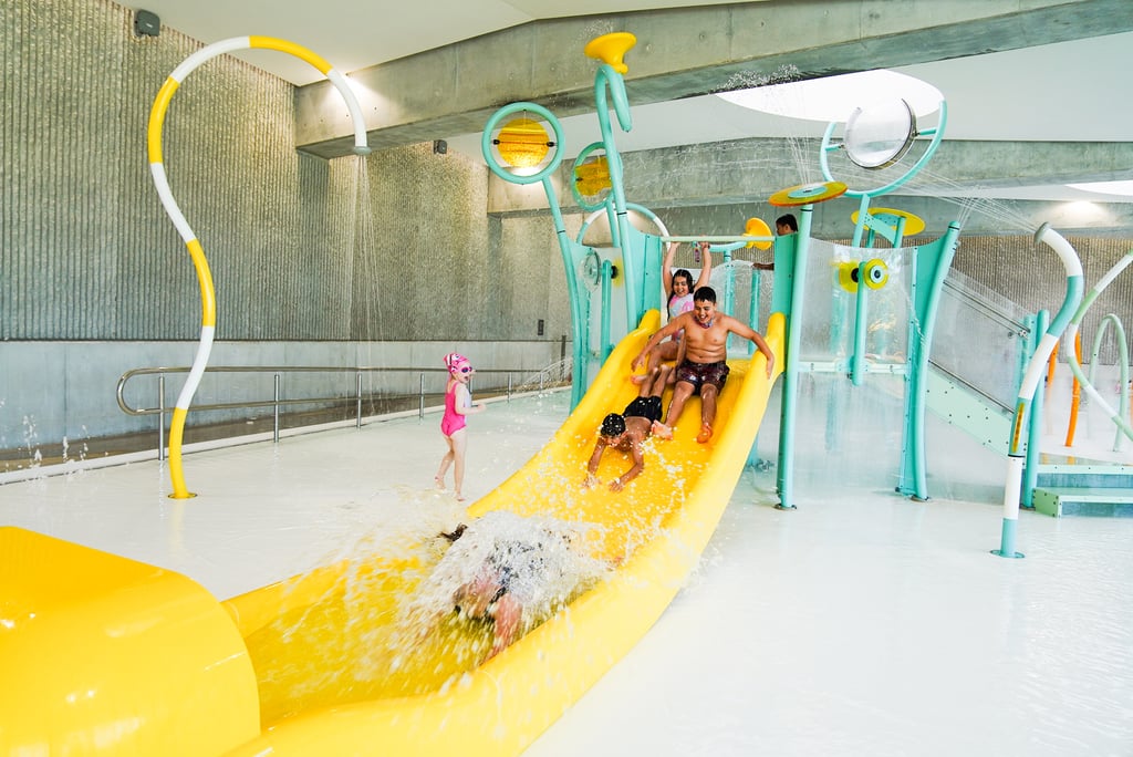 Kids enjoying the slides and play equipment at the Parramatta Aquatic Centre