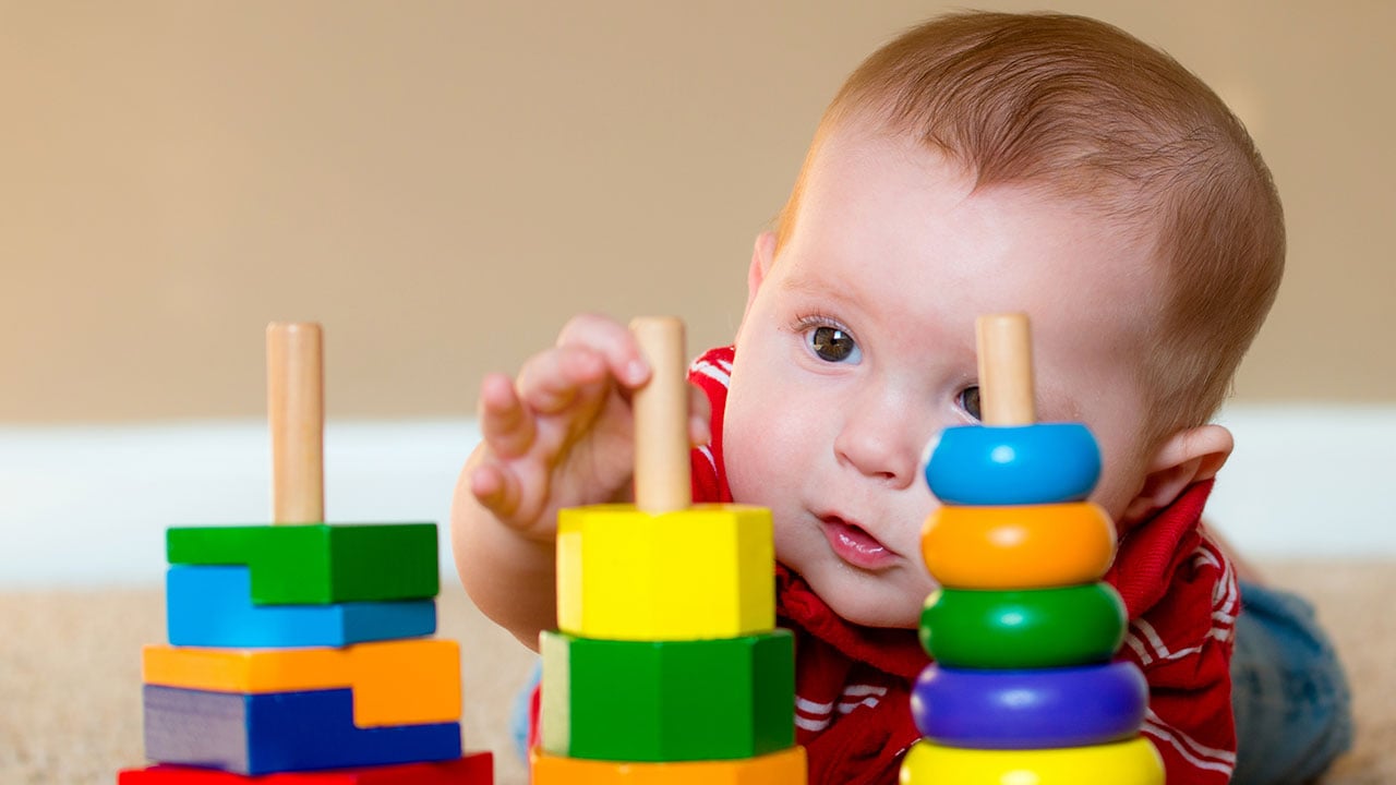 two young children playing with toys