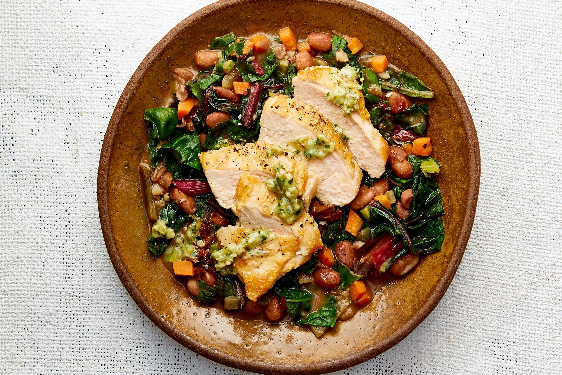 Tuscan Chicken Breast with White Bean and Chard Ragout