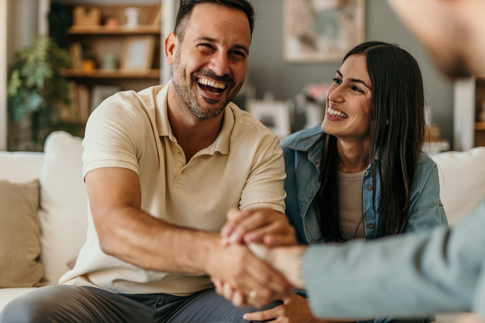 A couple reviewing their insurance claim settlement