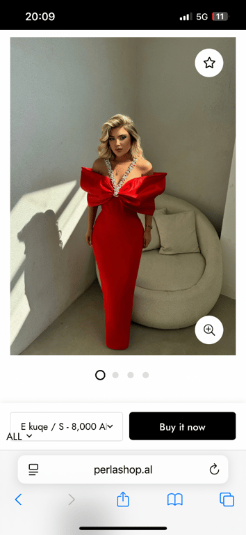 Fotografi e fustan i kuq me fjongo  në LIST.AL