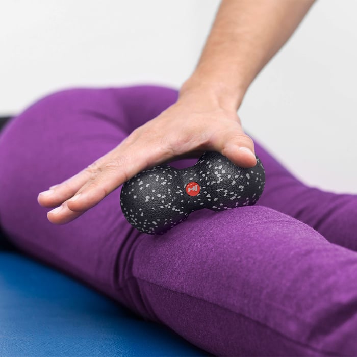 Triggerpointmassage van bovenbeen met duobal