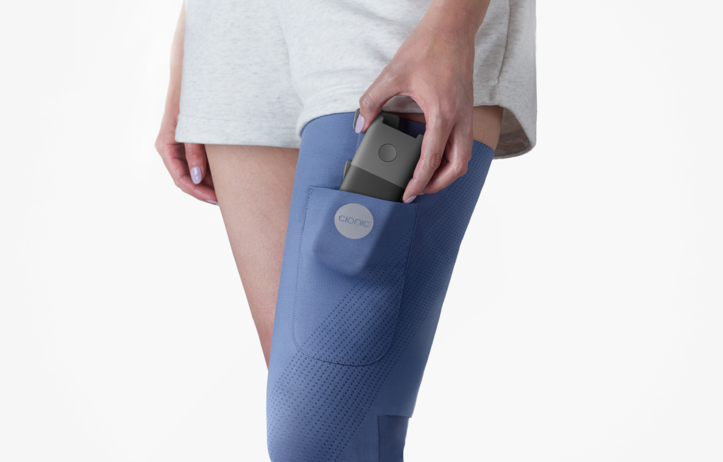 Person wearing Cionic blue knee brace